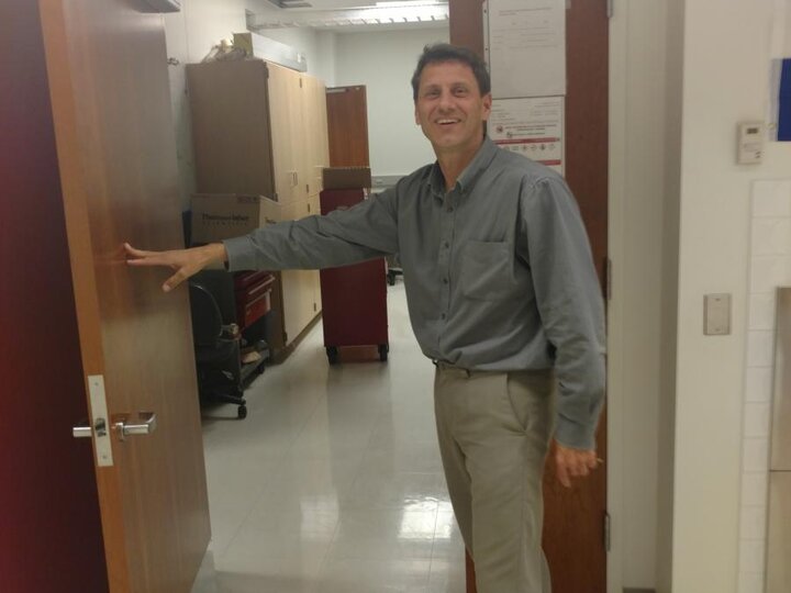 Herman Batelaan opening the door to his lab